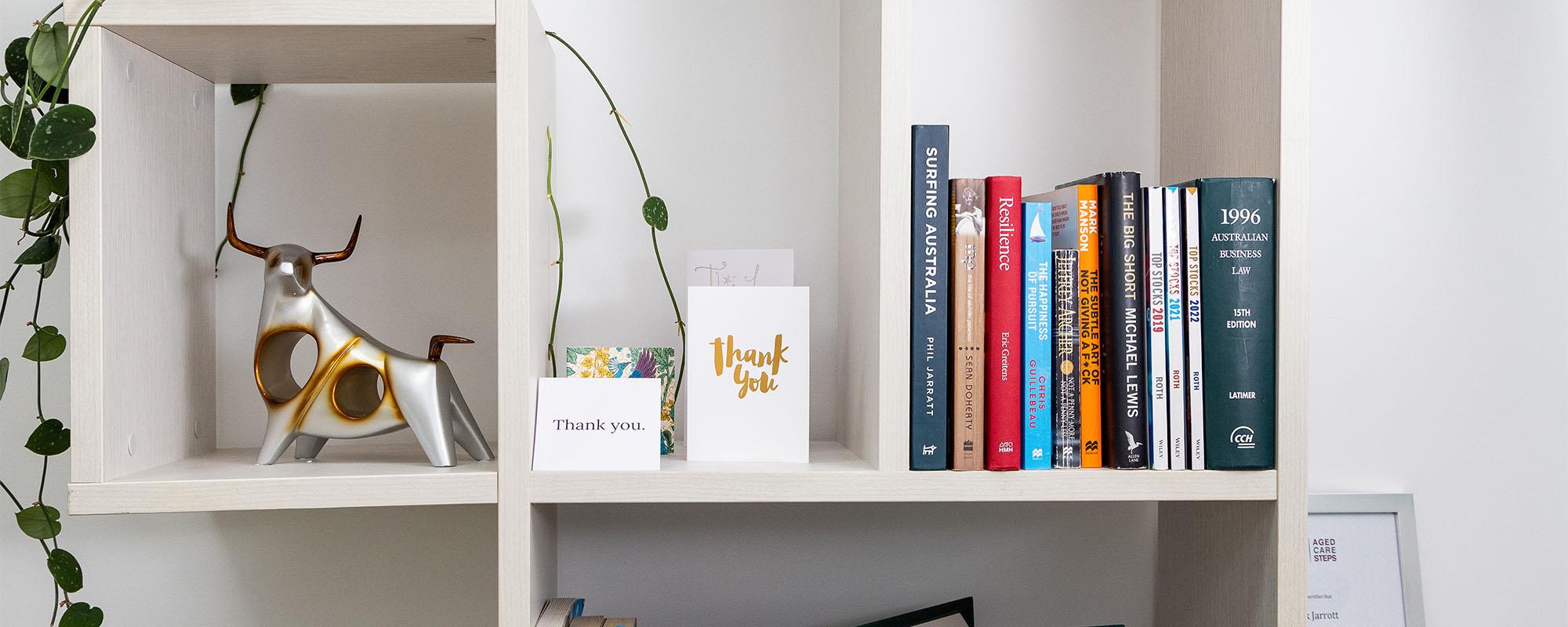 bookshelf with thank you cards