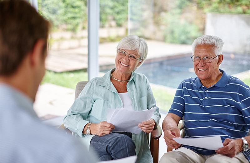 Elderly couple in meeting